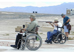photo of persons using wheelchairs at shooting range