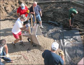 Figure 3 ---Placement of drainage fabric and rock on playground subsurface. 
